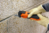 Oscillating Blade - Slicing through pliable joint sealant.