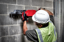 Milwaukee 14" Battery Saw - action image.